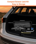 Heavy Duty 2.5 Ton Scissor Jack Car Tire Changing Emergency Tool Kit With Lifting Handle And Safety Stand For SUV Truck And Sedan Black in car trunk.