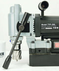 TYP-28A mini magnetic drill with annular cutter; black motor housing, silver gear head; BLUEROCK Tools mug in foreground.