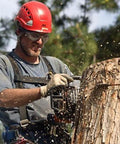 Arborist wearing Steel Mesh Anti Fog Safety Goggles 30 Mesh Eye Protection for chainsaw work, cutting a tree, debris shield visible