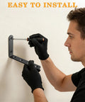 Person installing Heavy Duty L Shelf Brackets 5 By 3 Inch Badass Matte Black Floating Wall Mount Kit on wall.