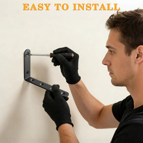 Person installing Heavy Duty L Shelf Brackets 5 By 3 Inch Badass Matte Black Floating Wall Mount Kit on wall.