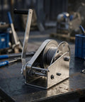 Tough As Nails 304 Stainless Steel Manual Winch Hoist Crank showing heavy duty gears on a workbench.