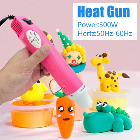 Portable Hot Air Gun For DIY Projects, pink design, used on clay models, 300W with 50Hz-60Hz power rating shown in image