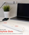 4 Pack 6 Outlet Power Strip With 12 Ft Extension Cord, Heavy Duty Flat Plug, shown mounted on wall beside laptop