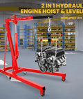 Heavy Duty 2 Ton Engine Hoist With Retractable Telescopic Boom And Six Rolling Caster Wheels Portable Hydraulic Cherry Picker hoisting an engine in a shop.