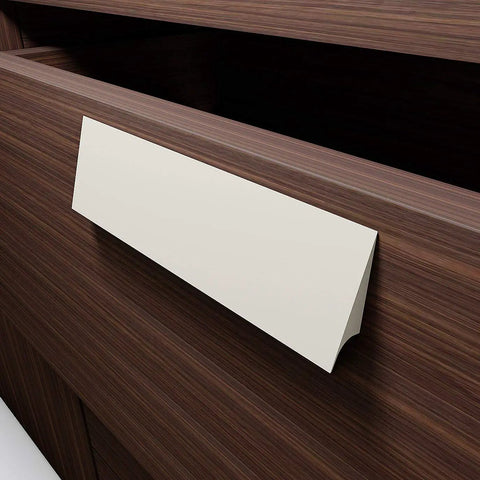 No Sweat Peel And Stick Finger Pull Handles For Cabinets on a wooden drawer, white adhesive handle, 1 x 4 3/4 x 3/8 x 1 3/8 inch.