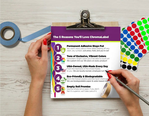 Person reviewing clipboard with features of Quarter Inch Metallic Silver Dot Stickers For Golf Club Launch Monitors And Golf Simulators