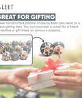 Hands exchanging gift with image of Assorted Ceramic Cabinet Knobs Set Of 12 In Grey And White With Vintage Old School Charm