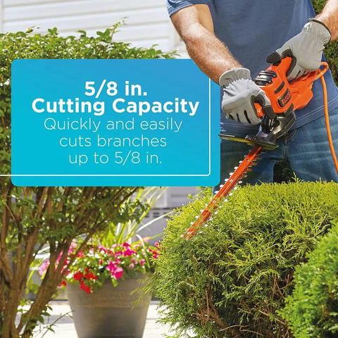 Corded 17 Inch Hedge Trimmer With 3.2 Amp Motor, Dual Action Blades in use cutting shrubs, 5/8 inch capacity highlighted in text.