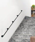 Solid As A Rock 16 Foot Black Industrial Pipe Handrail Wall Mounted Railing For Indoor Stairs on grey marble steps.