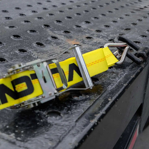 Ratchet Straps With Wire J Hooks, 2In x 15Ft, Classic Yellow Webbing, shown on flatbed for heavy hauling tie down