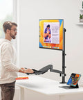Premium Ergonomic Sit Stand Monitor Desk Mount With Wide Keyboard Tray For 17 To 32 Inch Screens delivering super slick pneumatic spring height adjustment tech in use.
