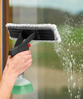 Bosch GlassVAC cordless window vacuum cleaner, side view; black body with white microfiber pad on glass