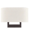 Bronze Wall Sconce With Contemporary Design, sleek modern lighting with oatmeal fabric shade, perfect accent for modern homes