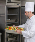 Chef loading vegetables into Commercial Reach In Freezer With Solid Swing Door Keeps Things Frosty Down To Ten Below Zero Fahrenheit R290 Hydrocarbon Compressor.