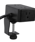 Black desk clamp power strip with dual outlets and USB ports for charging, ideal for home office and gaming setups.