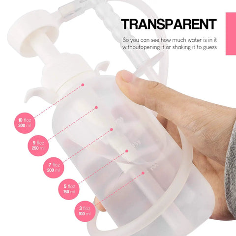 Hand holding Reusable Vaginal Cleansing System For Women, 300ml Capacity, with clear nozzle, latex free, transparent reservoir.