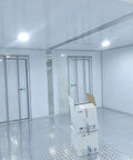 Custom Cold Room Build Top Shelf Heavy Duty Industrial Walk In Freezer interior with reflective flooring and assembly-ready door.
