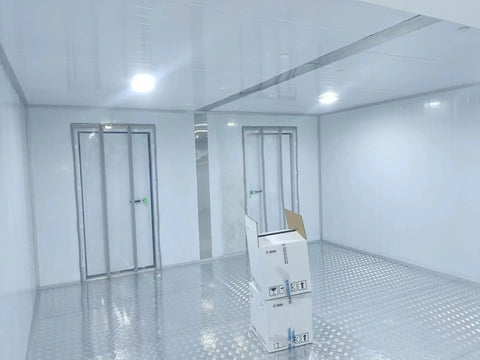 Custom Cold Room Build Top Shelf Heavy Duty Industrial Walk In Freezer interior with reflective flooring and assembly-ready door.