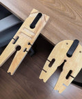 Two Pro Grade Jewelry Clamp Fixtures for Goldsmithing and DIY Crafting, wood workholding devices clamped on a bench.