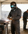 Welder in Automatic Welding Helmet With True Color Lens, Safety Cover, And Air Supply Respirator System in workshop