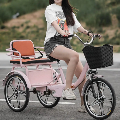 Hassle Free Fold Tandem Tricycle For Adults And Seniors With Rear Bucket Seat And Locking Safety Strap 20 Inch Front Wheel Heavy Duty Steel Frame Bright Pink Chill City Cruisers showing a woman riding.