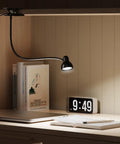 Clip-On Reading Light With Eye Care, 3 Color Modes And 10 Dimmable Levels, Flexible Gooseneck Desk Lamp on nightstand with books and clock