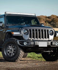 SUV with Slim 21 Inch LED Light Bar With 52 LEDs In A Single Row Spotlight Flood Combo For Offroad Driving on roof