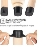 32 Pack Chair Leg Floor Protectors With Felt Bottom And Silicone Pads For Hardwood Floors Anti Scratch Noise Reducing Rubber Caps For Chairs Black Medium Size, showing stretch fit on wood legs.