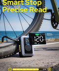 Mini Bike Tire Pump With Digital Gauge And Auto Stop next to bicycle tire on road with PSI display showing 120