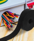 Reusable Plant Themed Hook And Loop Cable Ties Keep Your Setup Hella Tidy With These Self Adhesive Wire Organizers, black strap on wooden desk.