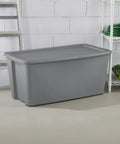 Go Big On Storage With This 50 Gallon Gray Bin Featuring Heavy Duty Latches And Secure Recessed Lid And Extra Large Stackable Plastic Tote Built Tough For Moving Bulk Gear And Closet Hauls, shown in a storage area.