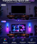 GOODEA Rechargeable RGB Wall Sconce with 2 Replaceable Batteries in a modern living room, illuminating a TV area with vibrant colors.