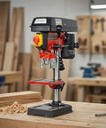Rock Solid Benchtop Drill Press Eight Inch Swing Five Speed Motor One Half Inch Steel Chuck on wood table with shavings.