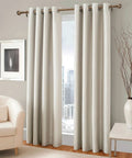Antique Brass Curtain Rod Set 1 Inch Heavy Duty Adjustable Drapery Rods 18 To 88 Inches with round finials holding beige curtains
