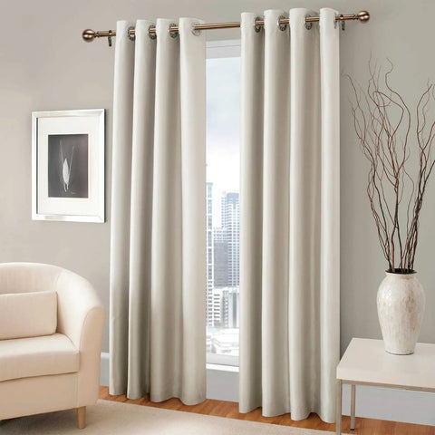 Antique Brass Curtain Rod Set 1 Inch Heavy Duty Adjustable Drapery Rods 18 To 88 Inches with round finials holding beige curtains