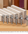 Pro Grade Three Flute Carbide Tipped Roundover Router Bit Seven Piece Set With Shear Geometry One Quarter Inch Shank displayed beside wood pieces