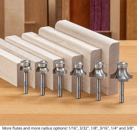 Pro Grade Three Flute Carbide Tipped Roundover Router Bit Seven Piece Set With Shear Geometry One Quarter Inch Shank displayed beside wood pieces