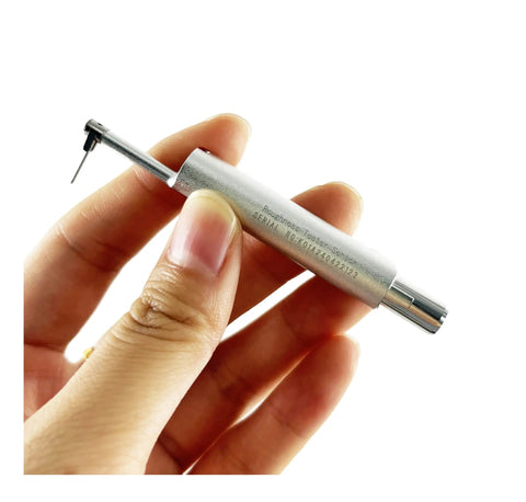 Top Shelf Surface Roughness Tester With Slim Needle For Tricky Grooves And Curved Surfaces Heavy Duty Metal Stand held in hand.