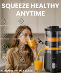 Keerain Electric Orange Juicer Hand-Free Citrus Squeezer with 100W Motor And Cleaning Brush extracting juice into a glass.