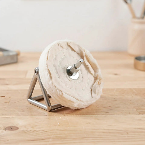 6 Pack Soft White Polishing Pads For Drill With 1/4 Inch Shank, showing a single polishing pad on a metal stand.