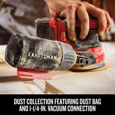 Hand using V20 Cordless 5 Inch Orbital Sander Bare Tool With 12,000 OPM on wood, showing onboard dust bag and vacuum connection