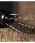 Close-up of the Next Level Espresso Distribution Tool With Retractable Stainless Steel Needle for portafilter clump crushing.