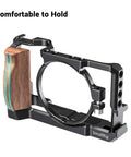 Vlog Camera Cage For Sony RX100 VI And RX100 VII With Removable Wooden Side Grip shows metal frame, accessory mounts, and comfortable grip.