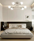 Dope Modern Sputnik Chandelier Ceiling Light Fixture With Six Lights installed in a bedroom, nickel finish, adjustable arms.
