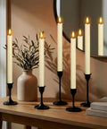 Ivory Flameless Taper Candles With Timer 6 Pack Battery Operated LED Flickering 3D Flame Real Wax Candles on wooden table