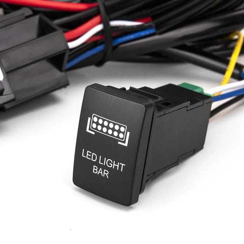 Toyota LED Wiring Harness Kit With LED Light Bar Push Button Switch for Tacoma and more, weather resistant design close-up view.