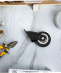 Four Piece Heavy Duty Sliding Door Roller Wheels And Rock Solid Side Mount Casters For Barn Doors Cabinets And Furniture Featuring An Adjustable Trolley Pulley Kit that shows a black caster on a marble countertop.