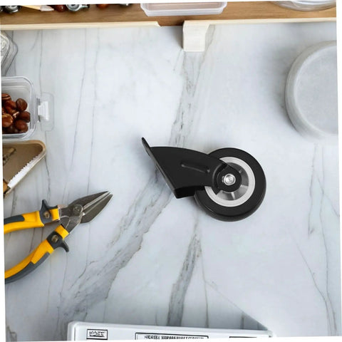 Four Piece Heavy Duty Sliding Door Roller Wheels And Rock Solid Side Mount Casters For Barn Doors Cabinets And Furniture Featuring An Adjustable Trolley Pulley Kit that shows a black caster on a marble countertop.