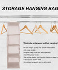 Four Tier Hanging Closet Storage Bag With Thick Oxford Fabric Drop Dead Durable Foldable Door Organizer Heavy Duty Wardrobe Rack Big Time Space Saver For Any Room on a clothing rack with hangers.